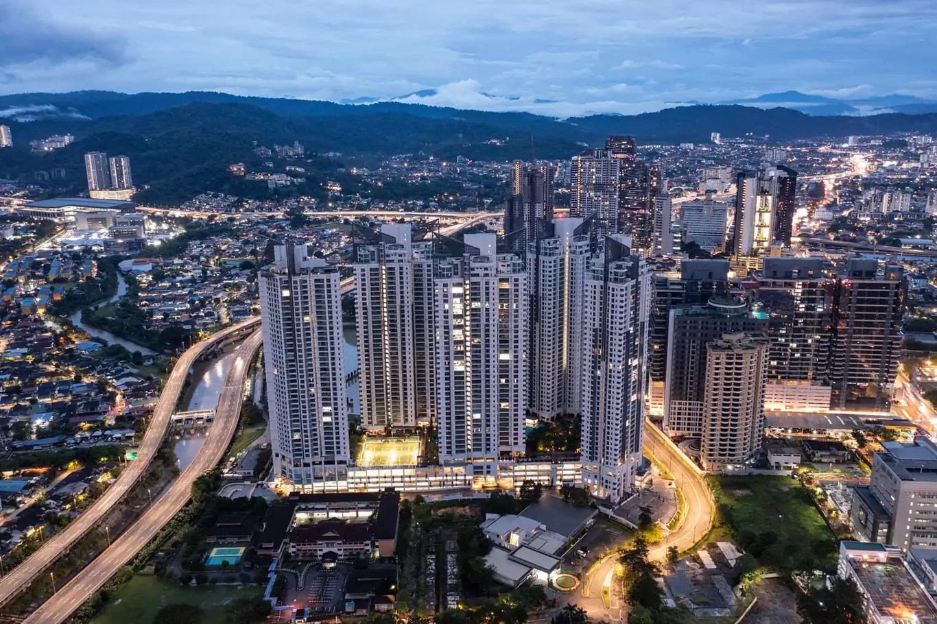 Dusk aerial view of the completed Cappella Embassy towers over Ampang Hilir and the AKLEH highway, Kuala Lumpur , photograph